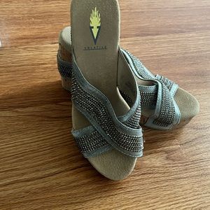 Volatile gray/silver wedge sandals.